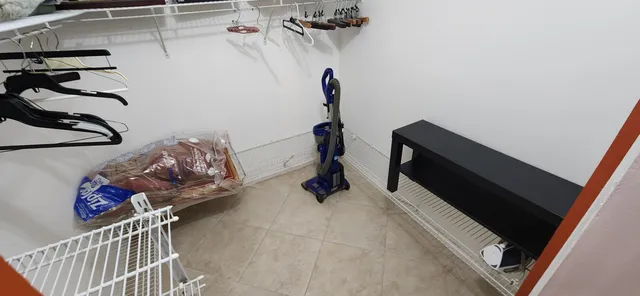 a view of storage and utility room with racks on the wall