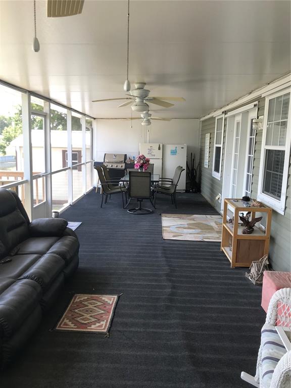 1081 6th Street Okeechobee, FL 34974 - Photo 16 of 22 a living room with furniture and a window