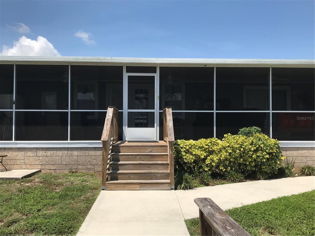 1081 6th Street Okeechobee, FL 34974 - Photo 18 of 22 a view of a house with a yard