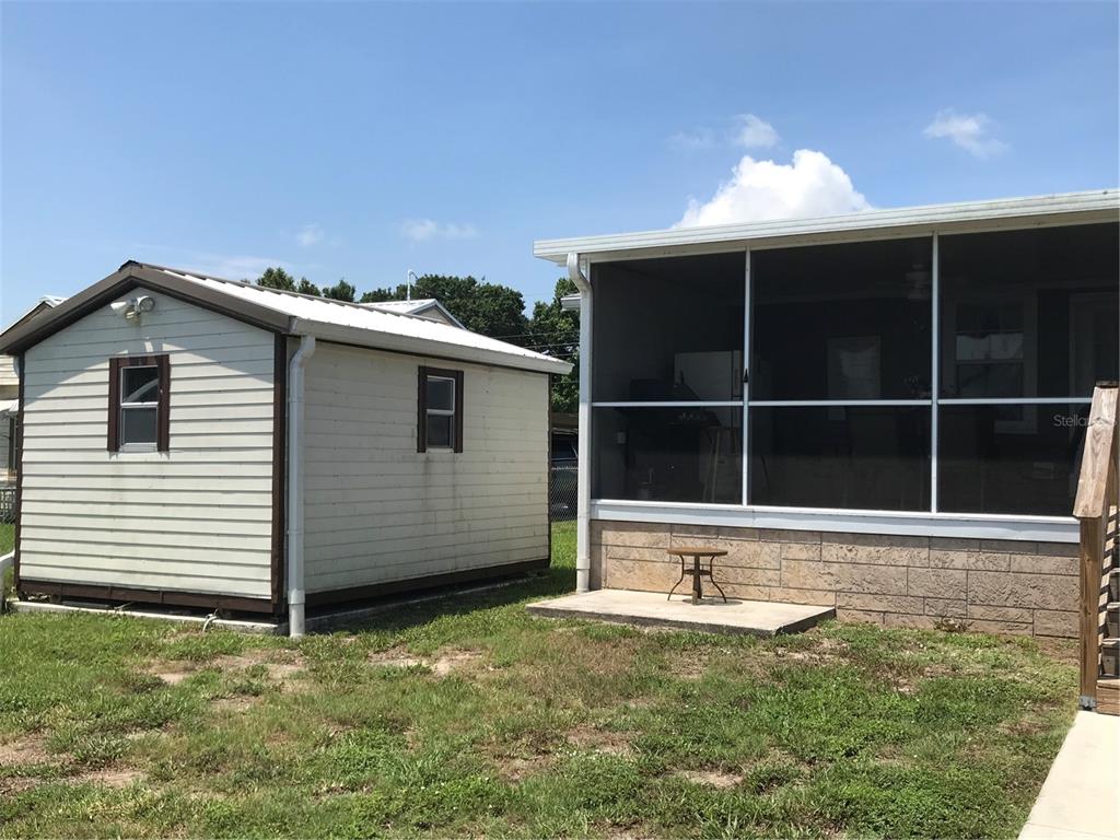 1081 6th Street Okeechobee, FL 34974 - Photo 19 of 22 a front view of a house with a yard