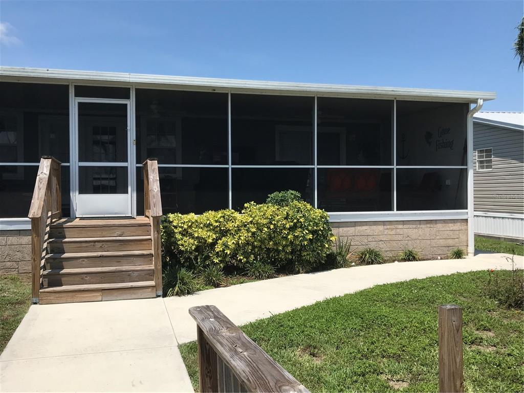 1081 6th Street Okeechobee, FL 34974 - Photo 20 of 22 a view of a house with a yard