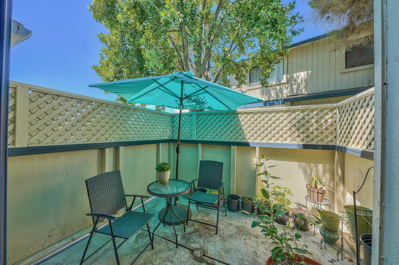 225 Silver Leaf Drive, Unit C Watsonville, CA 95076 - Photo 12 of 24 a patio with a yard table and chairs