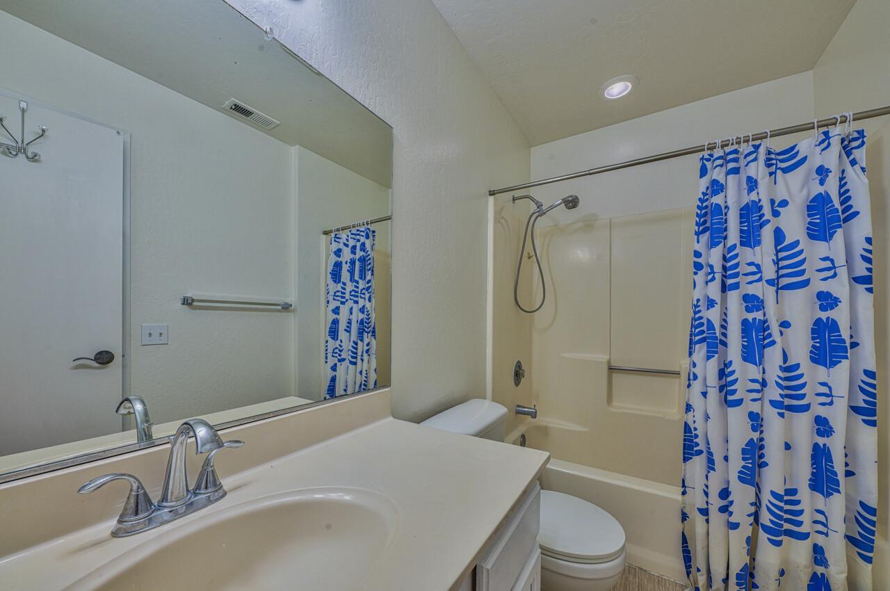 225 Silver Leaf Drive, Unit C Watsonville, CA 95076 - Photo 16 of 24 a bathroom with a sink toilet and shower