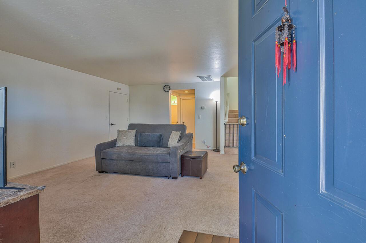 225 Silver Leaf Drive, Unit C Watsonville, CA 95076 - Photo 4 of 24 a living room with furniture and a potted plant
