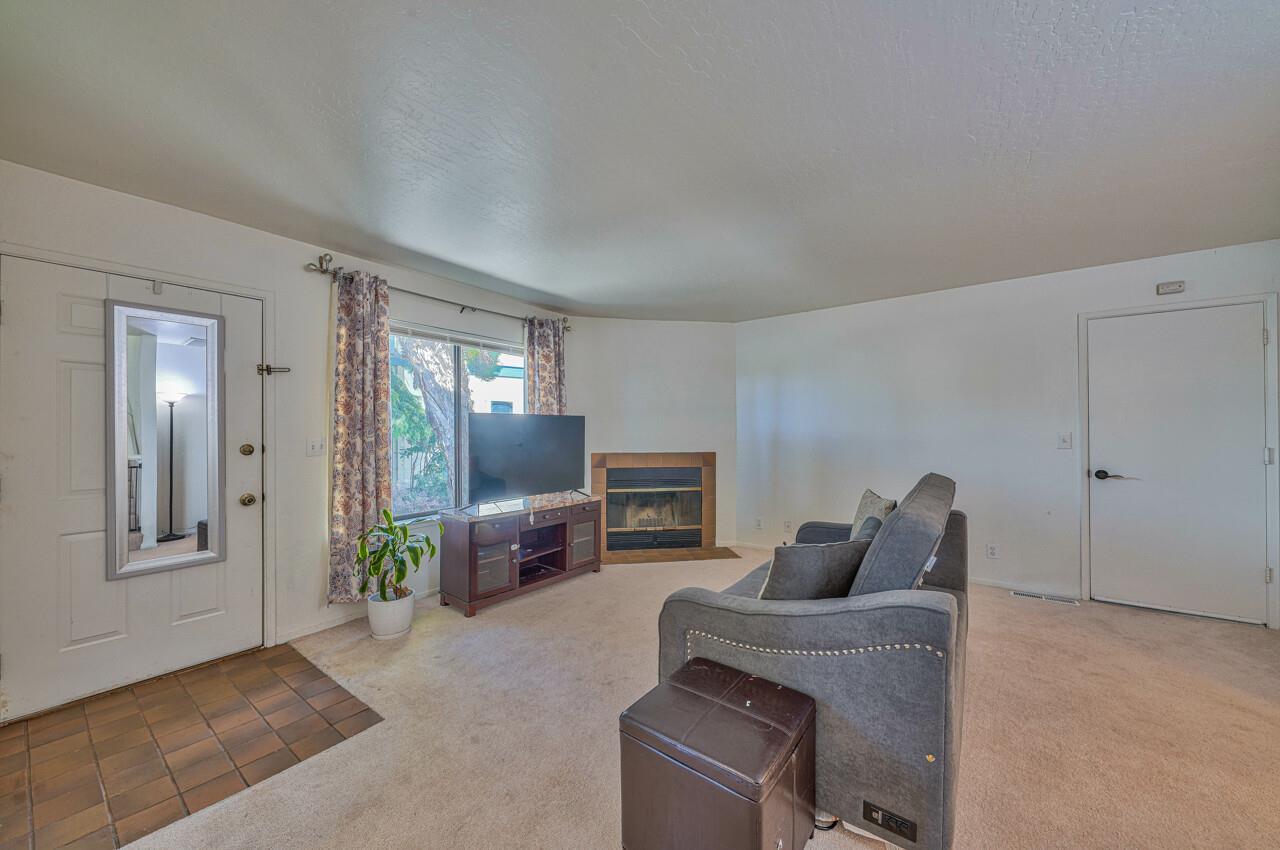 225 Silver Leaf Drive, Unit C Watsonville, CA 95076 - Photo 5 of 24 a living room with furniture and a flat screen tv