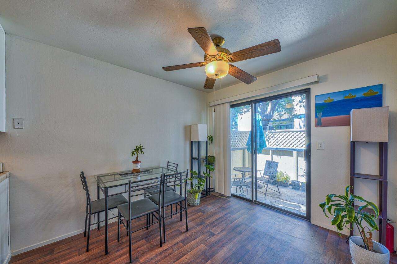 225 Silver Leaf Drive, Unit C Watsonville, CA 95076 - Photo 10 of 24 a dining room with furniture potted plants and wooden floor