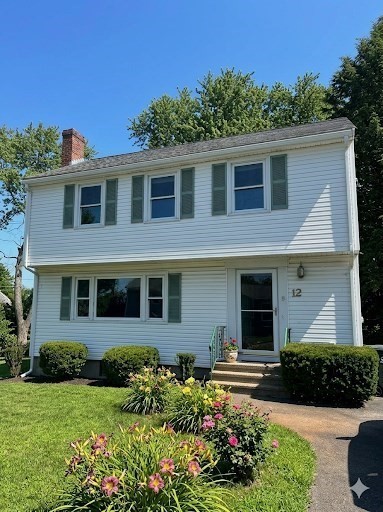 12 Wellington Ln Avenue Lexington, MA 02421 - Photo 1 of 15 a front view of a house with a yard