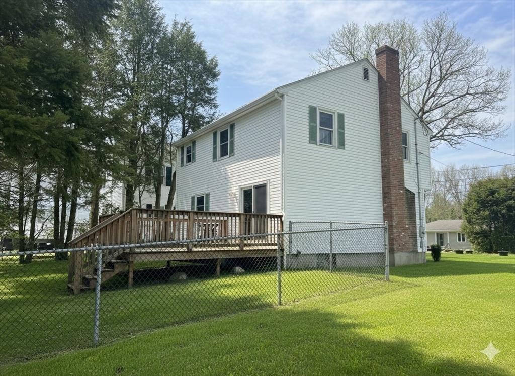 12 Wellington Ln Avenue Lexington, MA 02421 - Photo 2 of 15 a view of house with a yard
