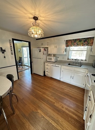 12 Wellington Ln Avenue Lexington, MA 02421 - Photo 7 of 15 a very nice looking kitchen with granite countertop a stove oven a sink dishwasher a dining table and chair with wooden floor