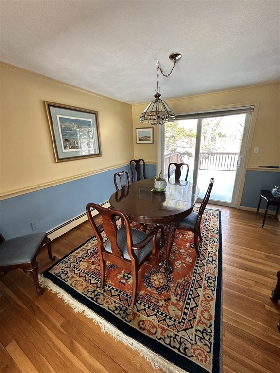 12 Wellington Ln Avenue Lexington, MA 02421 - Photo 9 of 15 a view of a dining room with furniture window and outside view