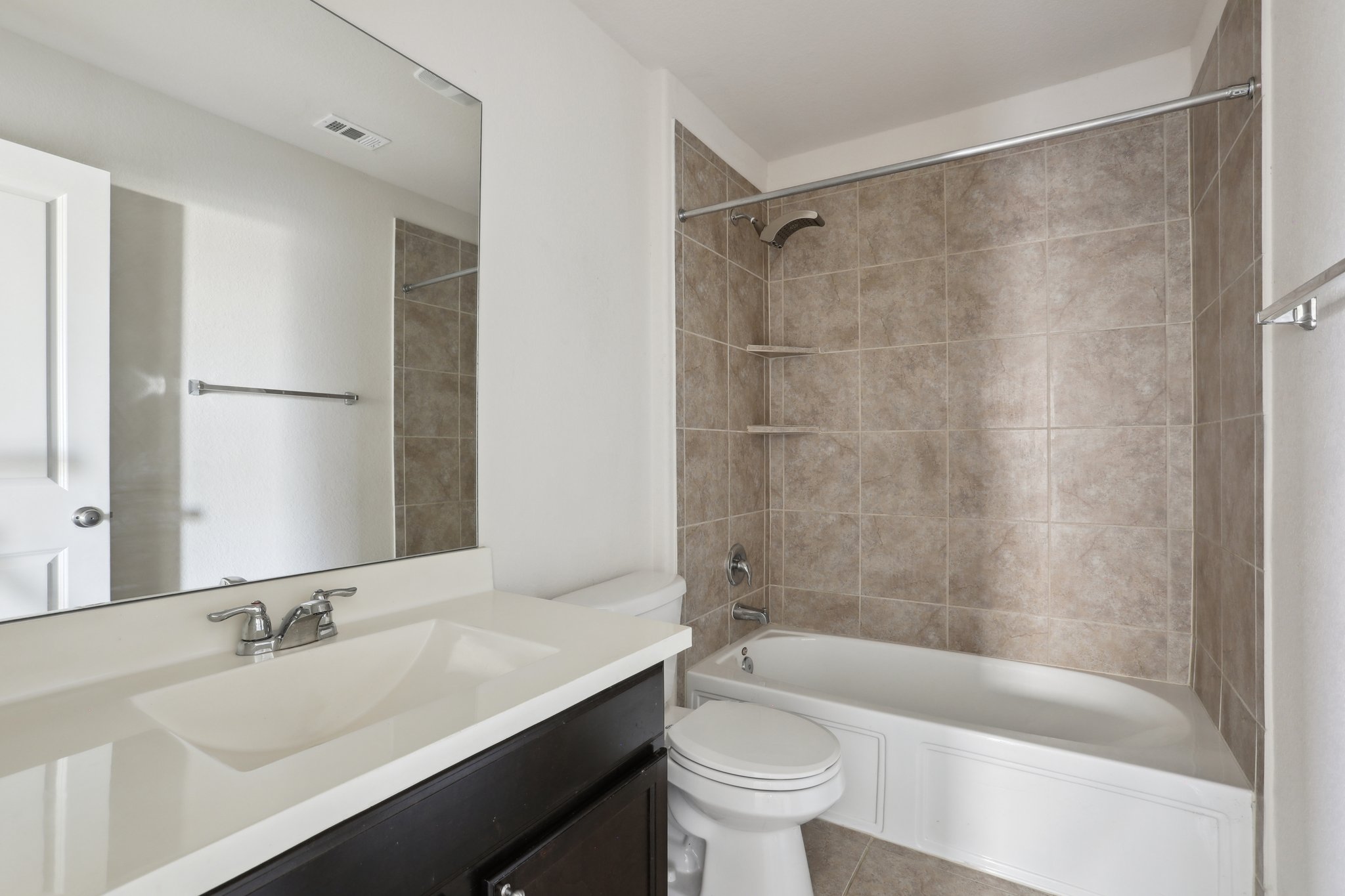 5713 Kennedy Street Austin, TX 78747 - Photo 17 of 30 Bathroom with vanity and shower / tub combination
