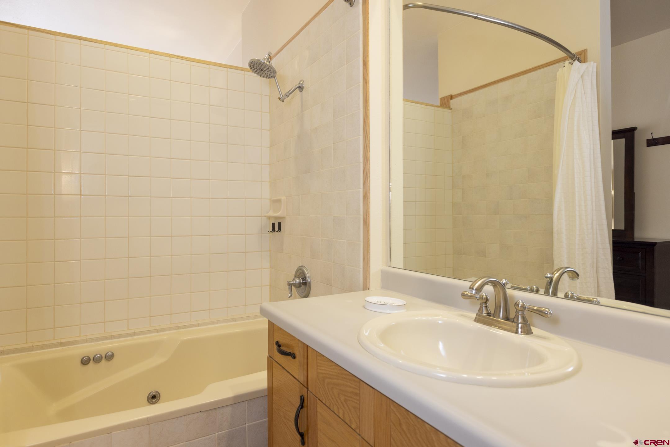 71 Needles Way, Unit 541 Durango, CO 81301 - Photo 12 of 32 a bathroom with a sink and a bathtub