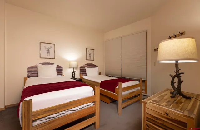 a bedroom with bed and a window