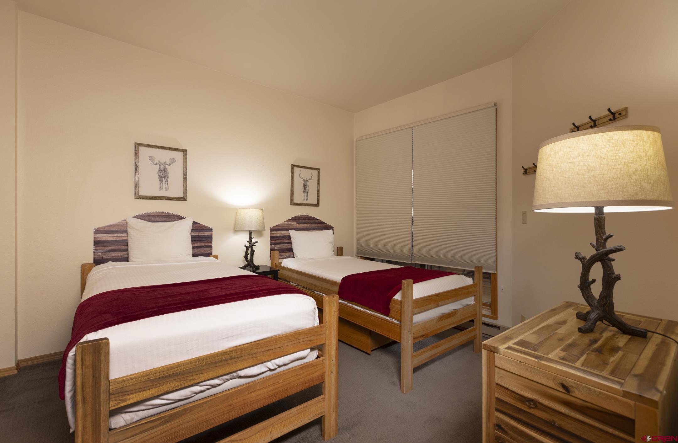 71 Needles Way, Unit 541 Durango, CO 81301 - Photo 15 of 32 a bedroom with bed and a window