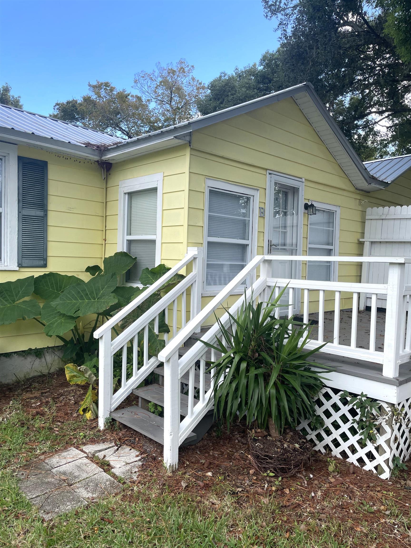 4588 First Avenue, Unit B St. Augustine, FL 32095 - Photo 1 of 8 a view of a house with a yard