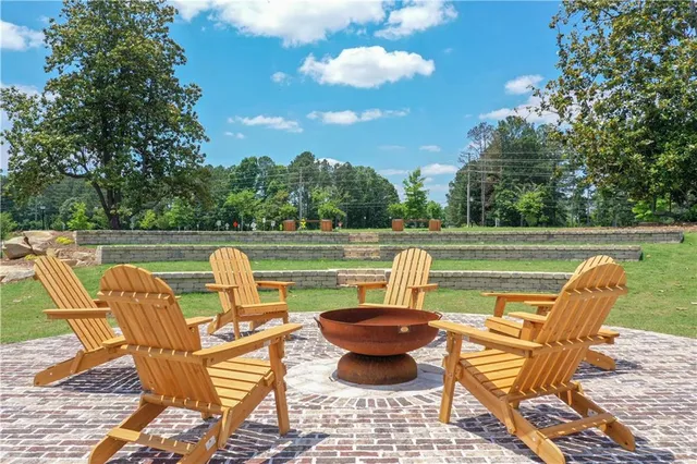 a view of a swimming pool and lounge chairs