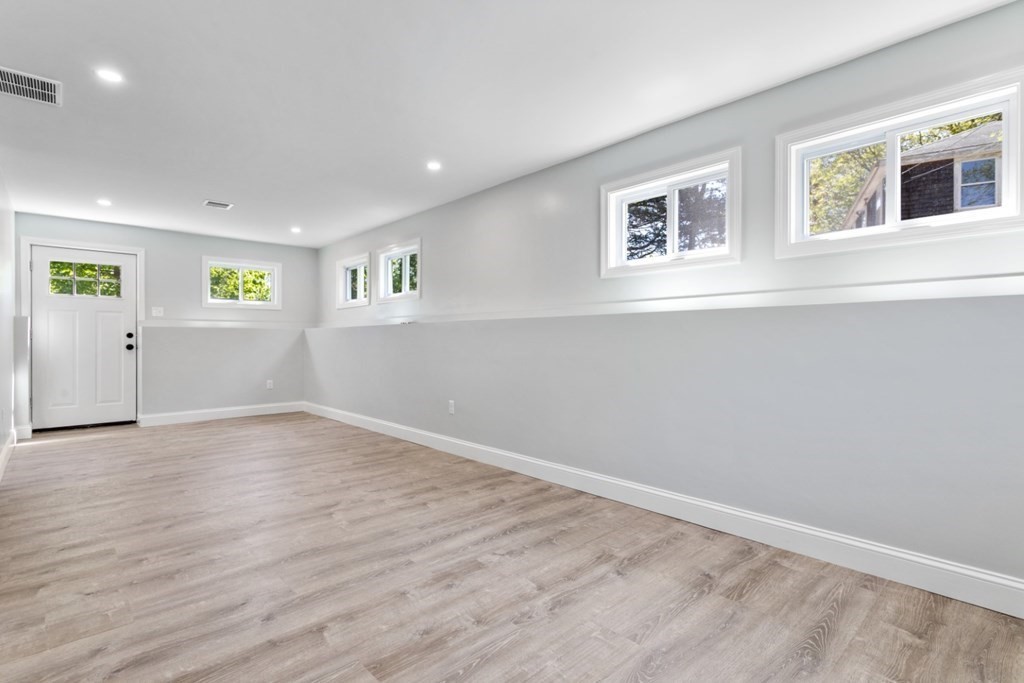 32 Herbert Avenue Saugus, MA 01906 - Photo 29 of 35 a view of empty room with wooden floor and window