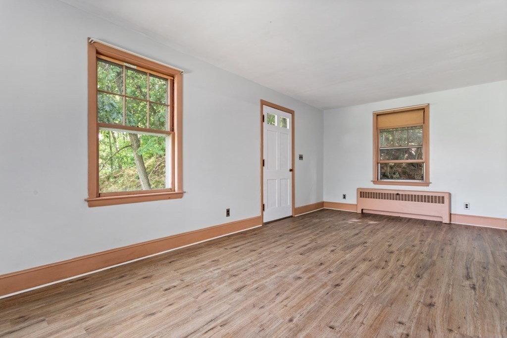 32 Herbert Avenue Saugus, MA 01906 - Photo 34 of 35 a view of an empty room with wooden floor and a window
