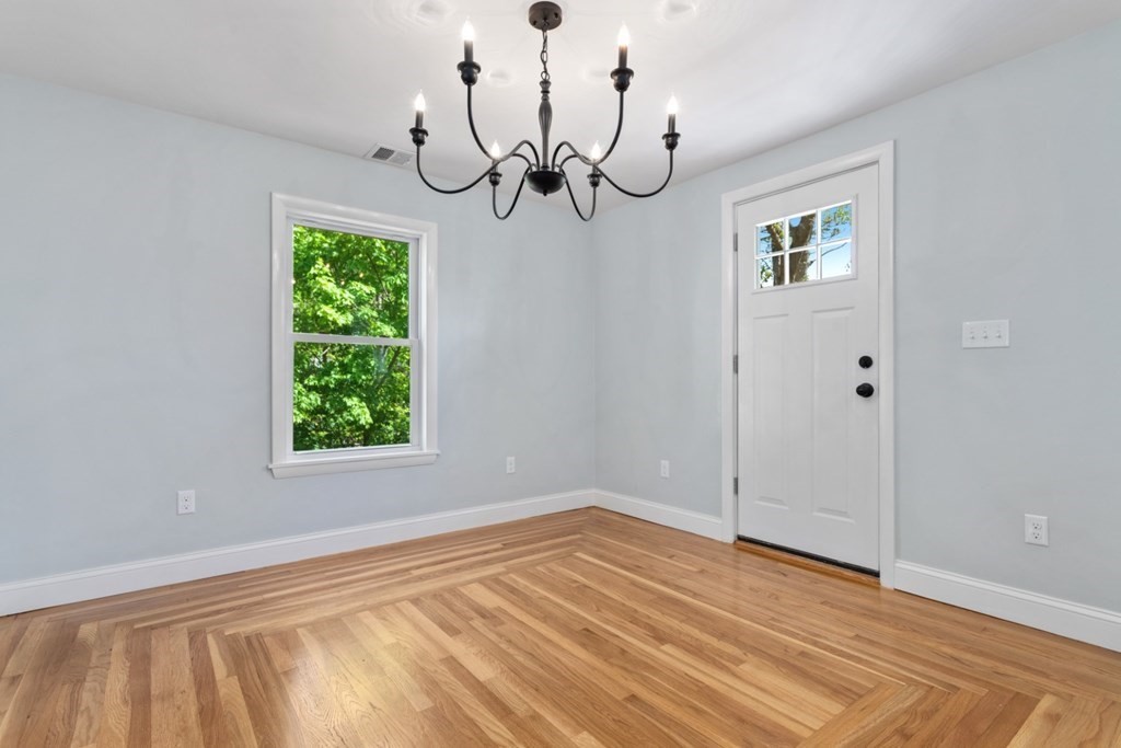 32 Herbert Avenue Saugus, MA 01906 - Photo 8 of 35 a view of empty room with window and wooden floor