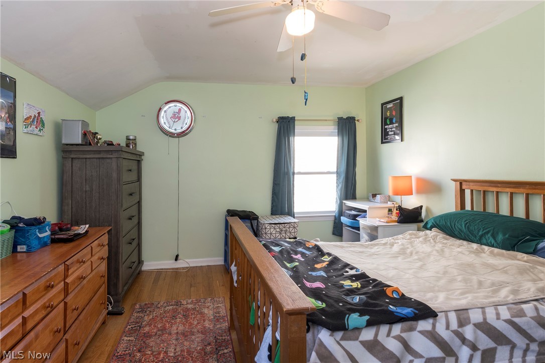 1170 Roland Road Lyndhurst, OH 44124 - Photo 22 of 36 Bedroom with lofted ceiling, dark hardwood / wood-style flooring, and ceiling fan