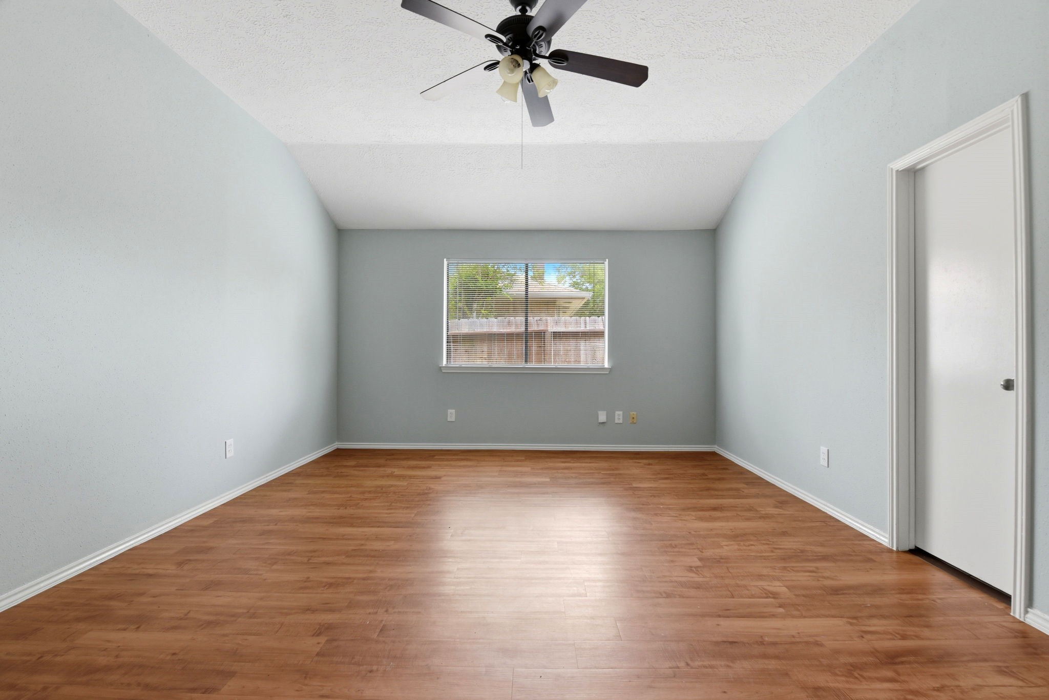21330 Golden Dove Drive Spring, TX 77388 - Photo 18 of 29 The first secondary bedroom is incredibly spacious and features a vaulted ceiling, making it a perfect front-facing home office or guest room.