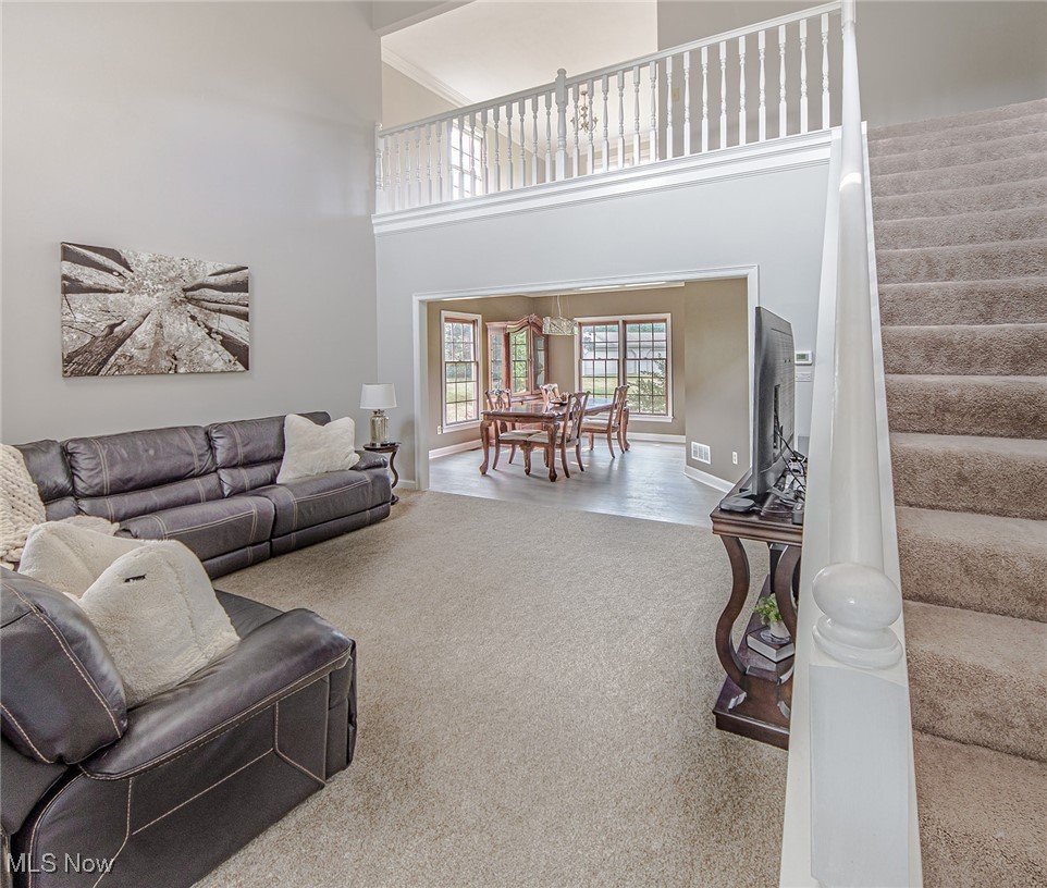 2394 Jacoby Road Akron, OH 44321 - Photo 6 of 45 2-story ceilings in the living room. The stairway off the entryway leads to the second level.