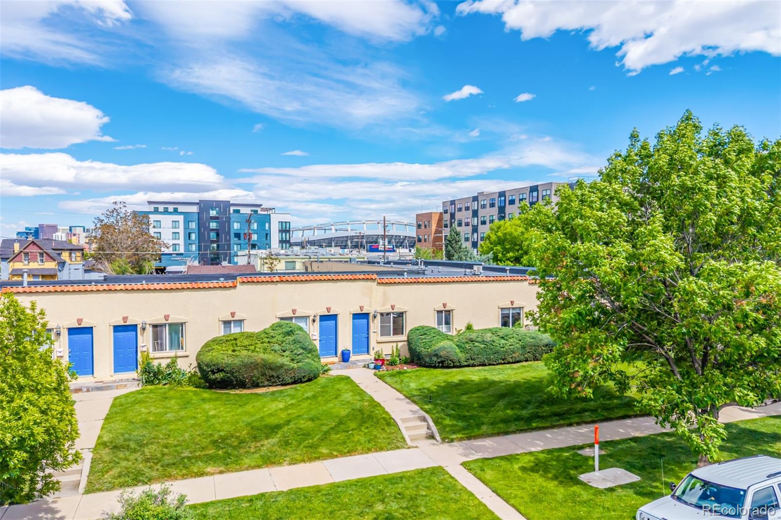 1800 Grove Street Denver, CO 80204 - Photo 24 of 35 a view of a swimming pool and a yard