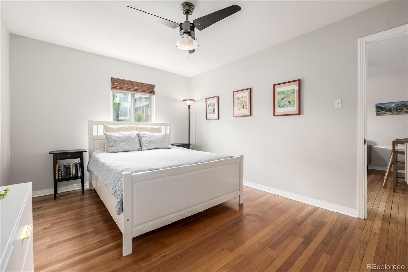 1800 Grove Street Denver, CO 80204 - Photo 6 of 35 a bed room with a bed and a window