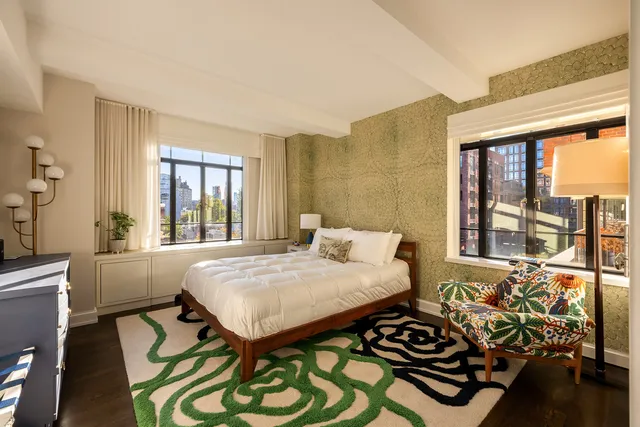 a spacious bathroom with a double vanity sink a mirror and a shower