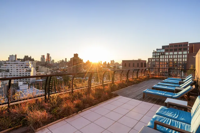 a bedroom with a bed next to a window