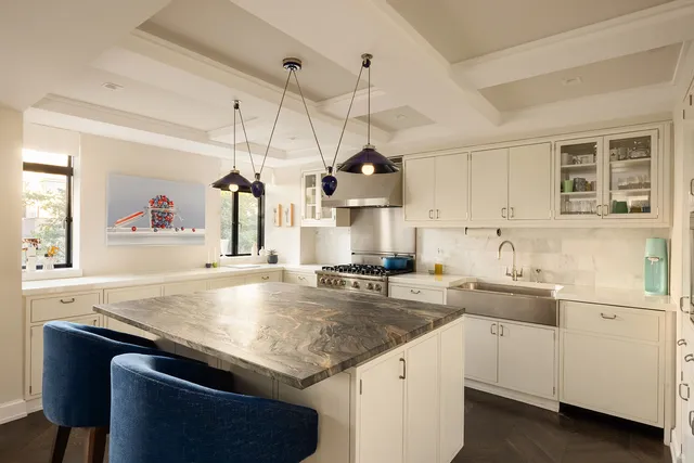 a living room with dining table and chairs