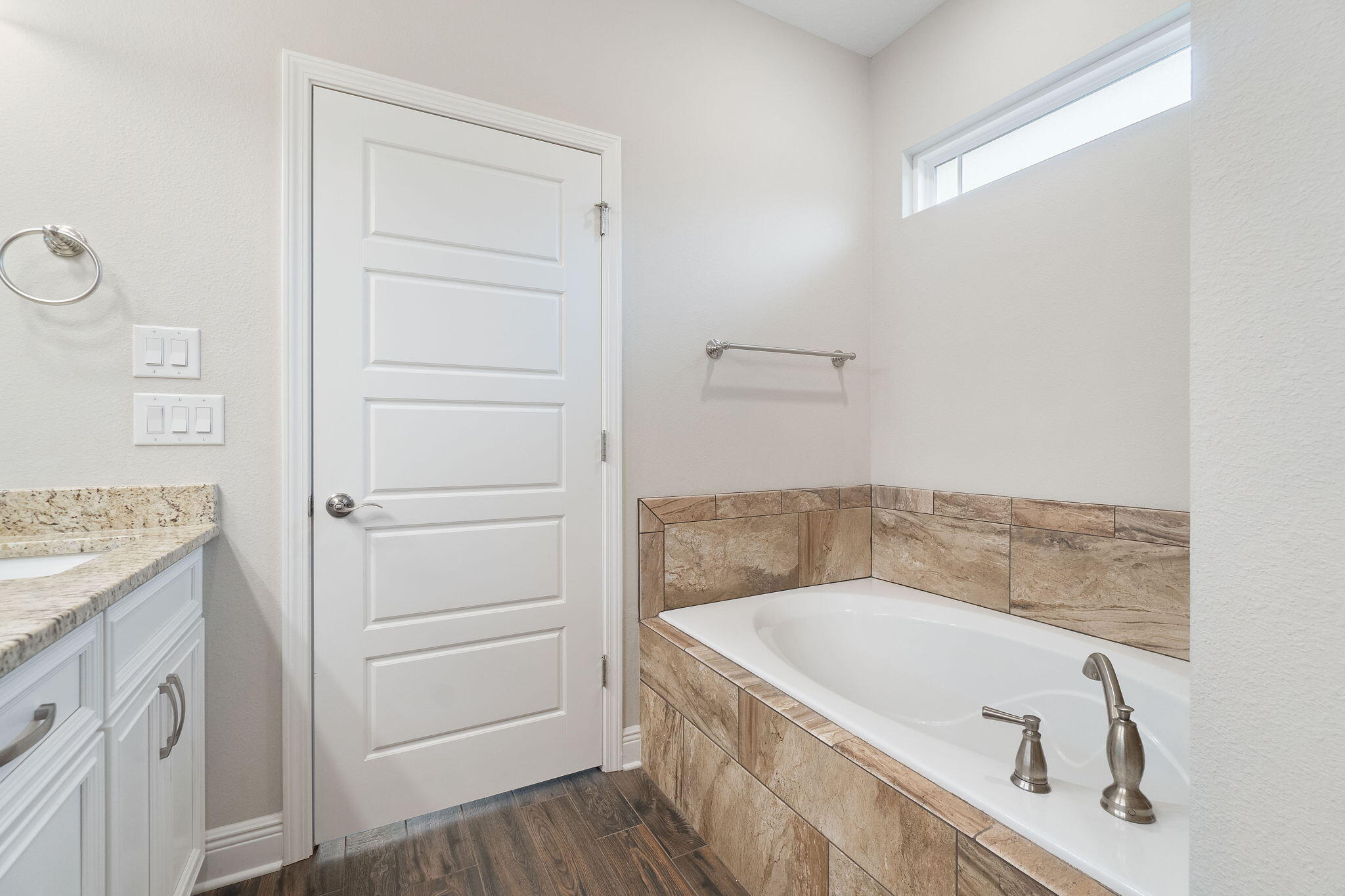 7745 Tidwell Road Pace, FL 32571 - Photo 30 of 57 a bathroom with a granite countertop bathtub sink and mirror