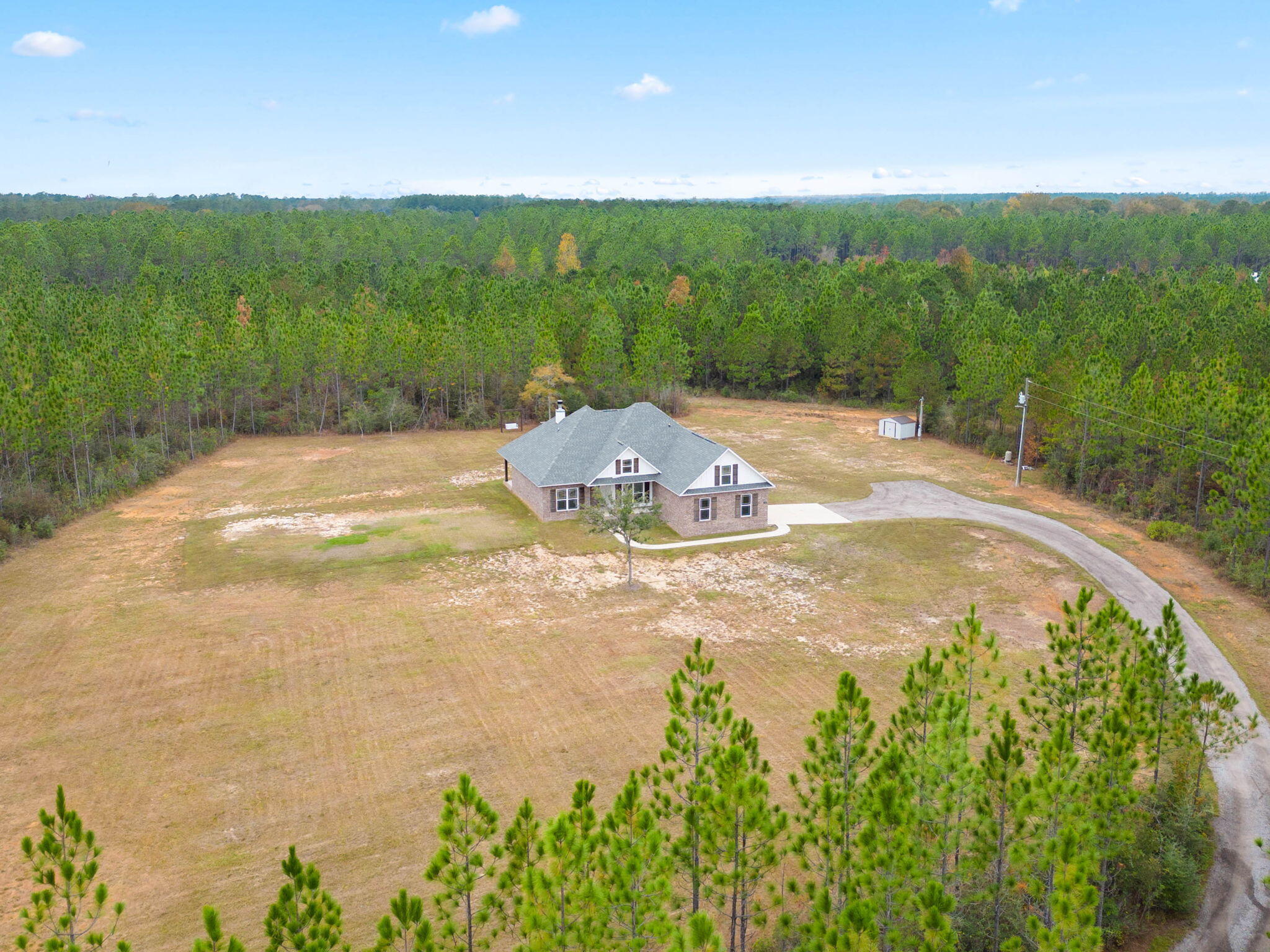 7745 Tidwell Road Pace, FL 32571 - Photo 54 of 57 a view of a swimming pool with a yard