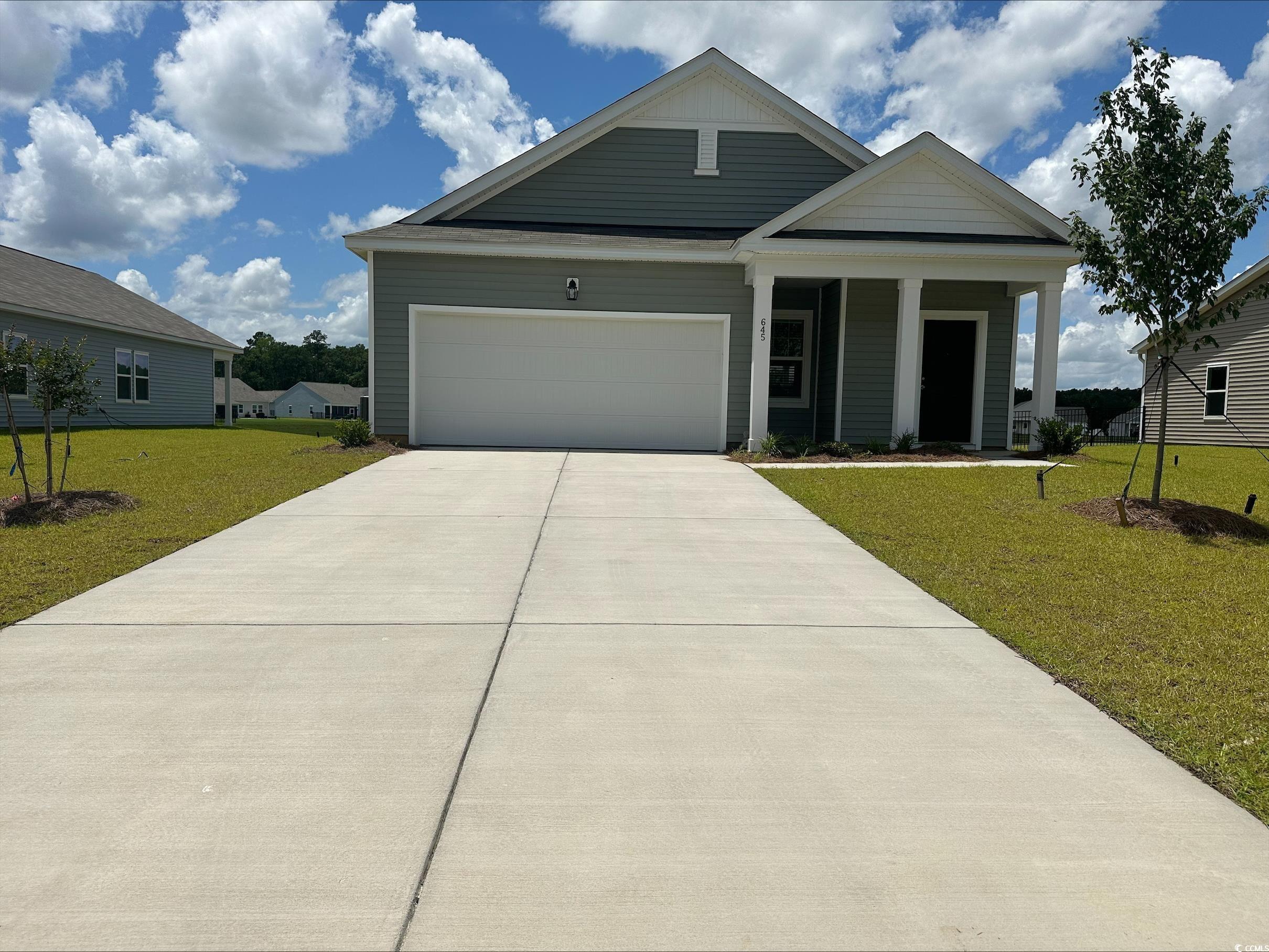 645 Castillo Drive Loris, SC 29569 - Photo 1 of 14 View of front of property with a front yard, an at