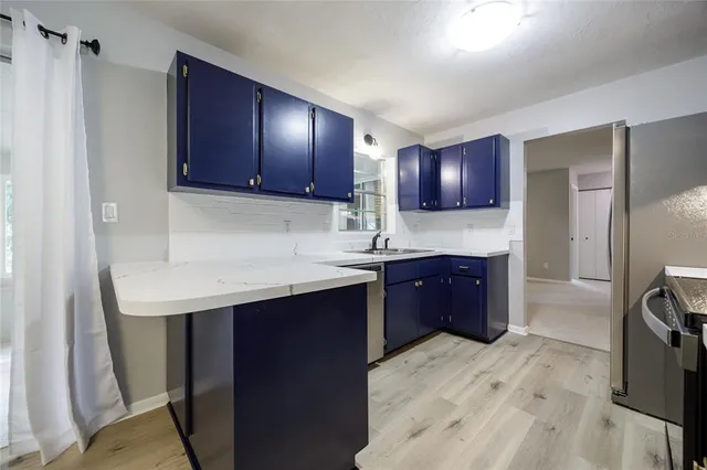 a kitchen with a stove and a microwave