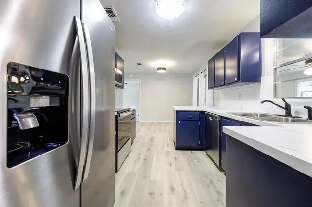 a view of a livingroom with a fireplace and window