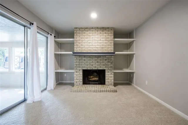 a view of a livingroom with a fireplace