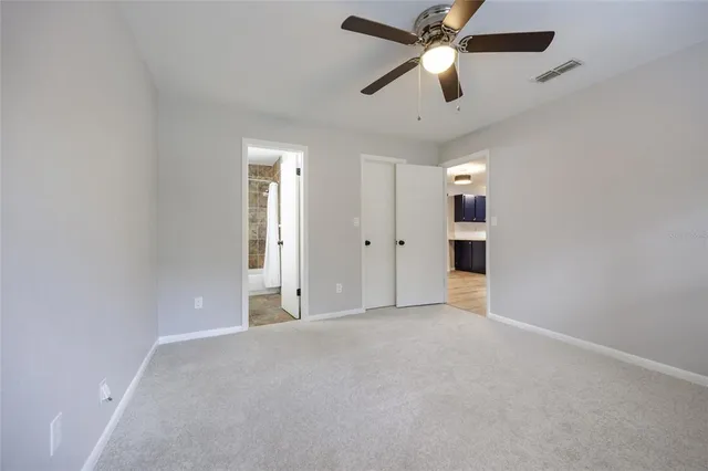 a bath tub sitting next to a white toilet