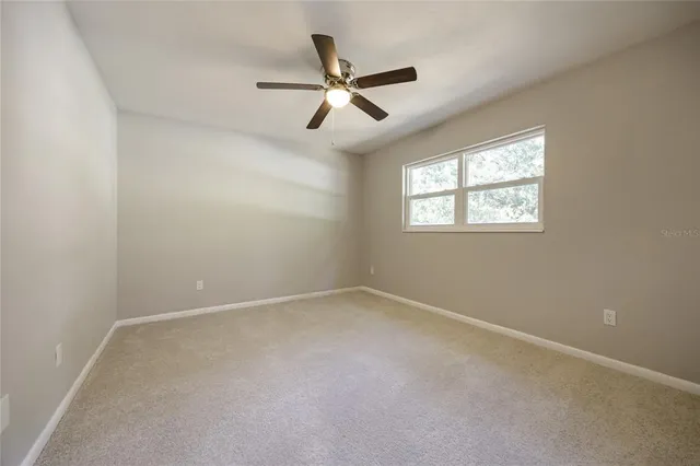 a view of house with outdoor space and garden