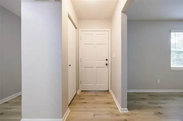 a view of a bathroom from a hallway