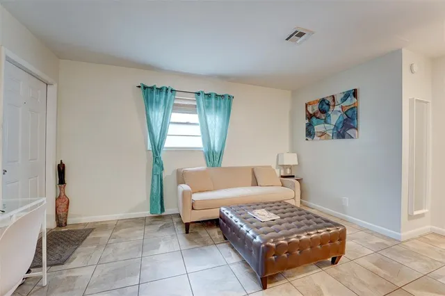 a living room with furniture and a window