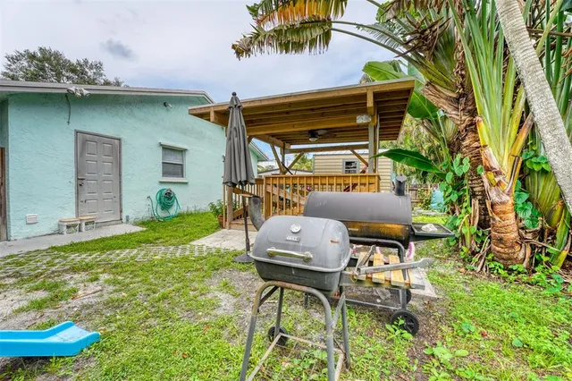 a patio with table and chairs