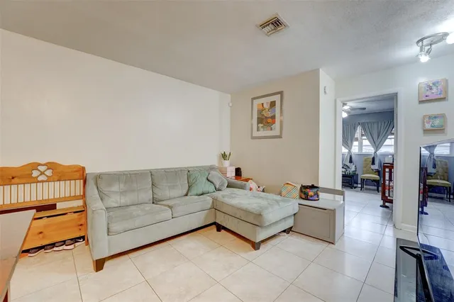 a living room with furniture and a couch