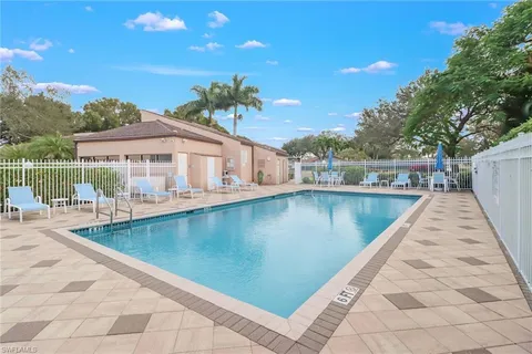 a view of a swimming pool with a patio