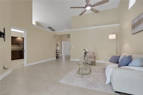 a room with furniture and white walls