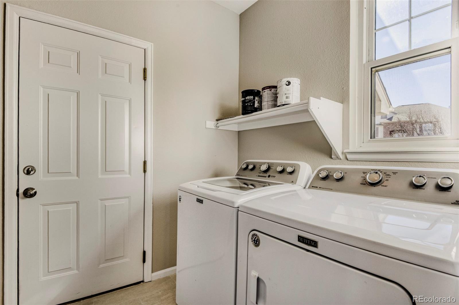 8573 South Mallard Court Highlands Ranch, CO 80126 - Photo 17 of 50 a utility room with dryer and washer