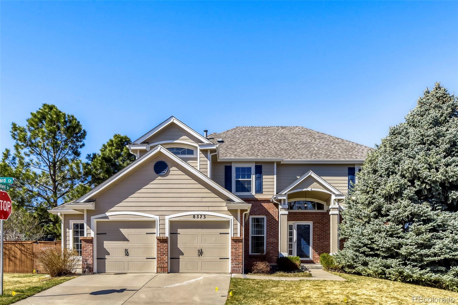 8573 South Mallard Court Highlands Ranch, CO 80126 - Photo 2 of 50 a front view of a house with a yard