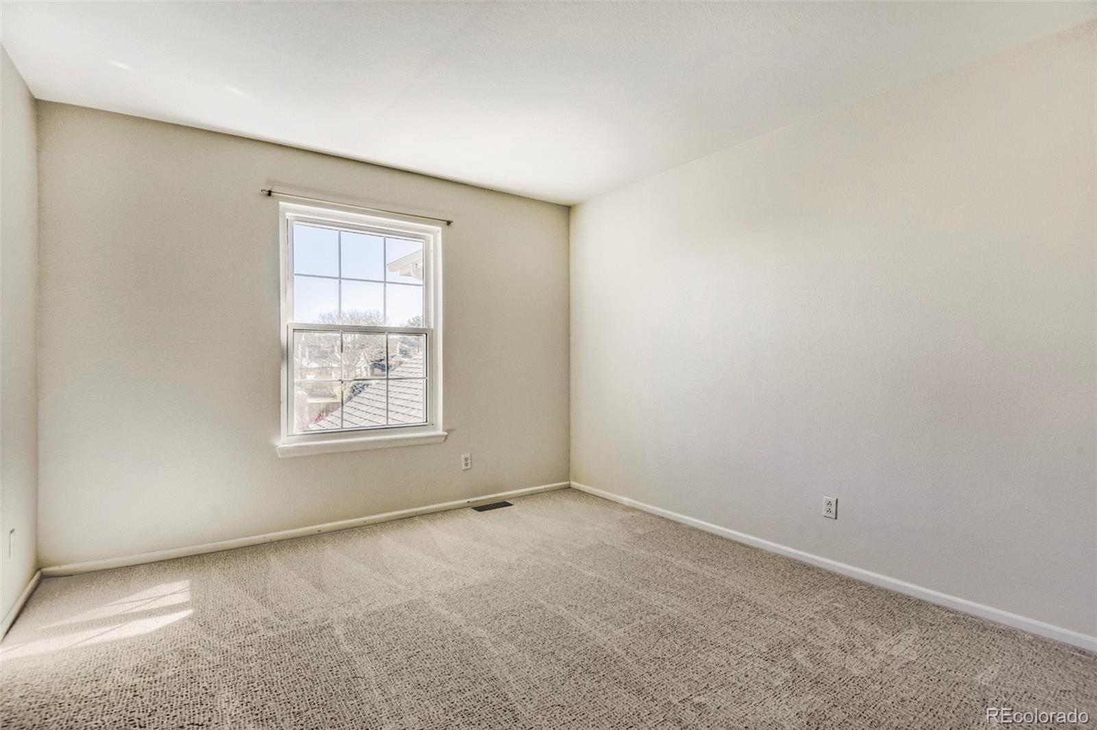 8573 South Mallard Court Highlands Ranch, CO 80126 - Photo 23 of 50 an empty room with windows