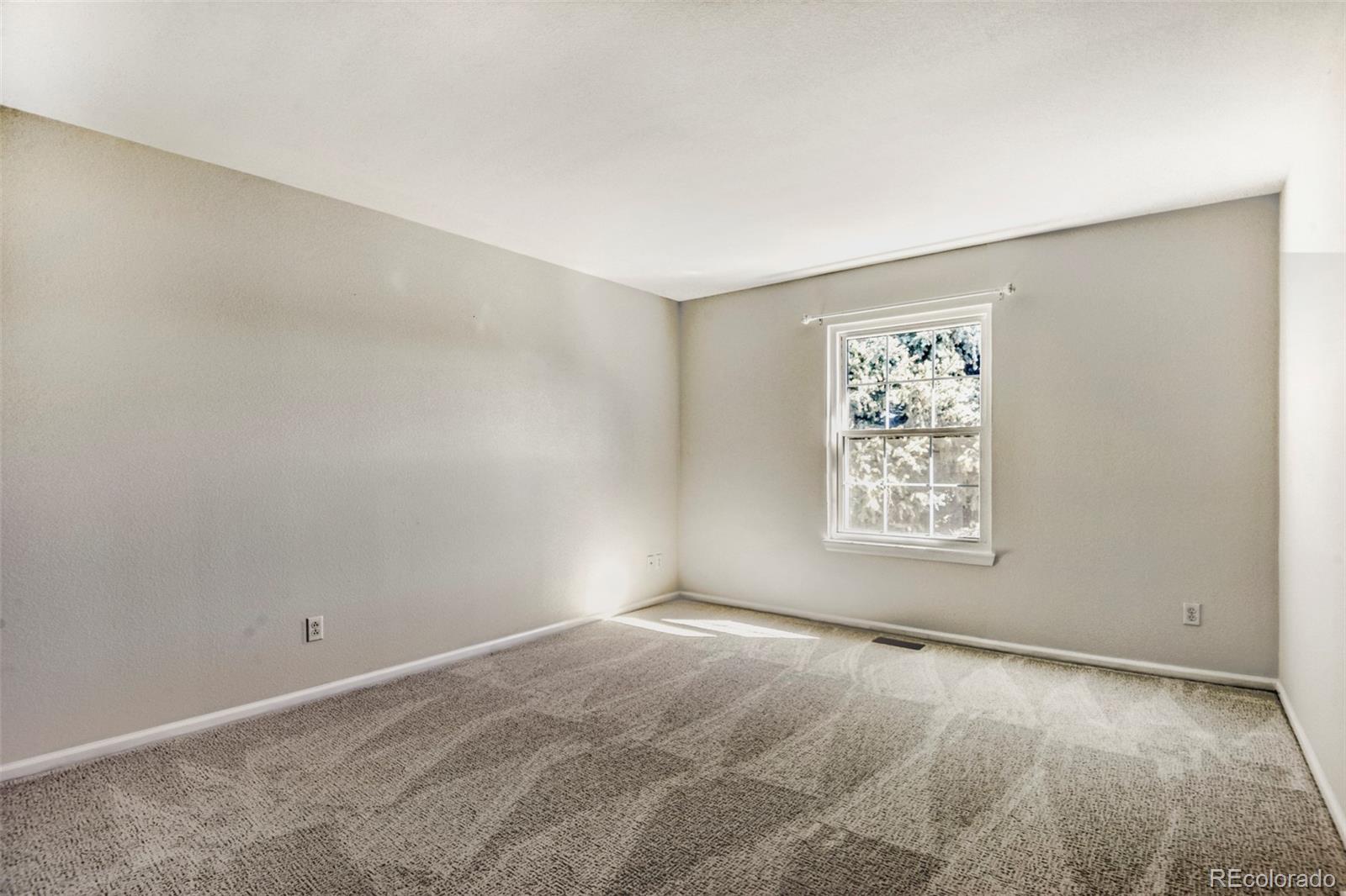8573 South Mallard Court Highlands Ranch, CO 80126 - Photo 25 of 50 an empty room with windows