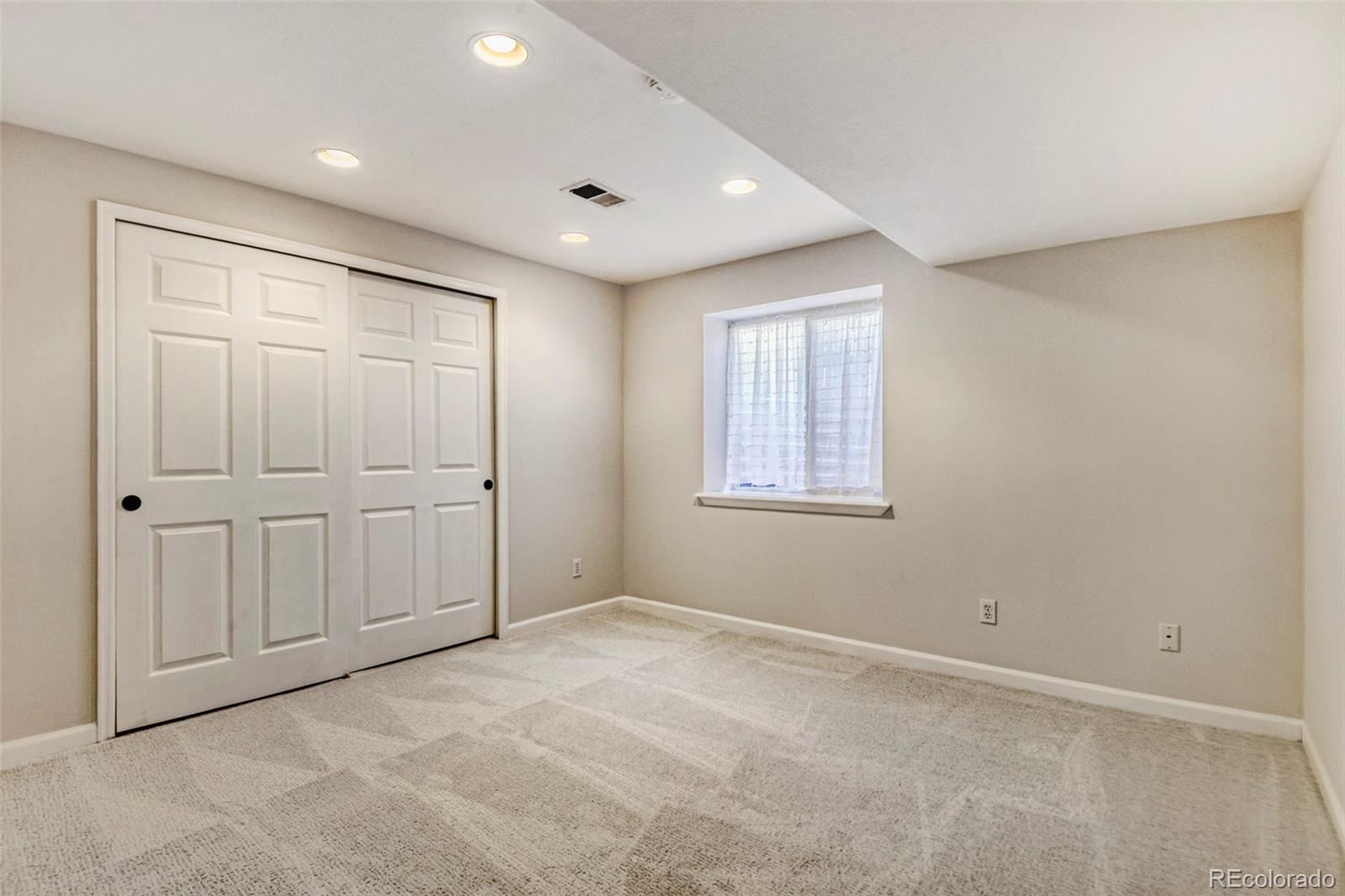 8573 South Mallard Court Highlands Ranch, CO 80126 - Photo 31 of 50 a view of an empty room with a window